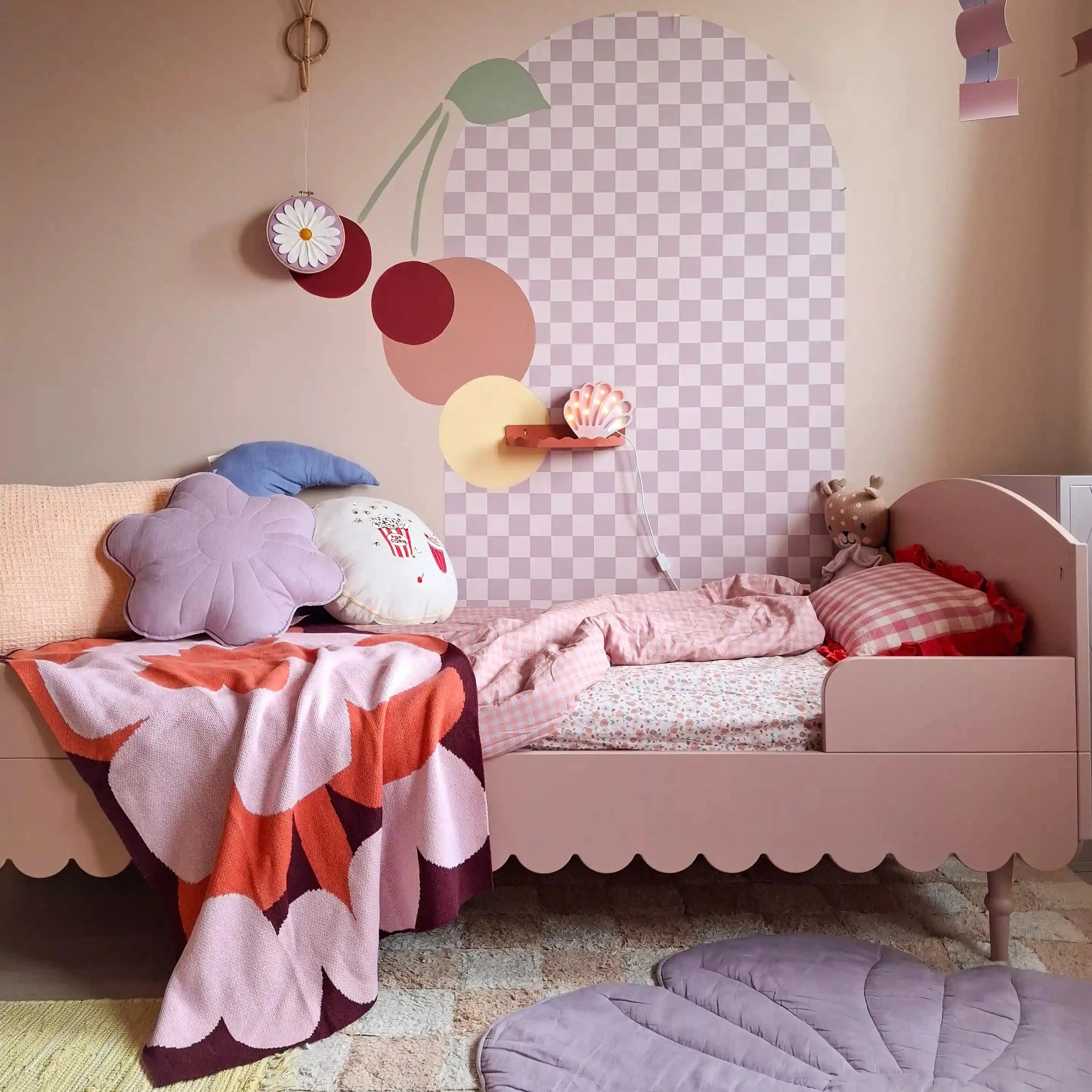 Pink girls kids room with flower blanket. Nursery decor artwork