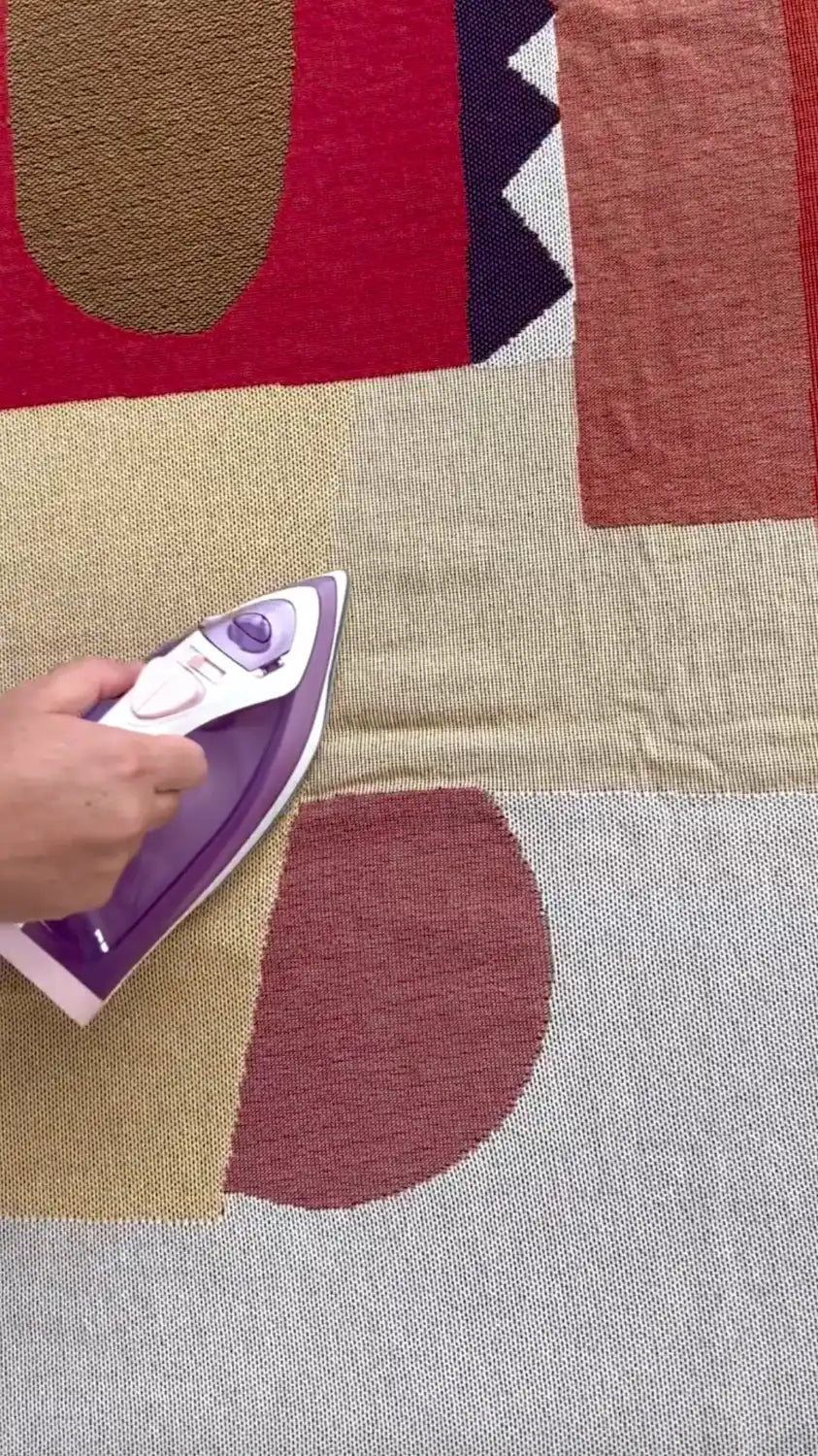 Ironing tapestry before hanging it as wall art decor