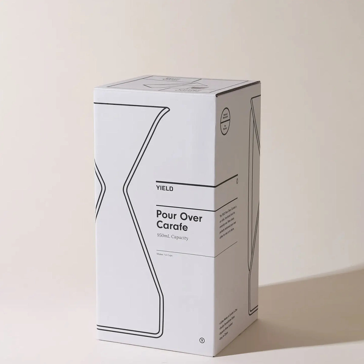 White box packaging with black text and graphics on a beige background