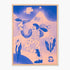 Wall art featuring a stylized illustration in blue and peach tones, showing a person holding a flower, a bird, mountains, and abstract floral shapes, mounted in a light wood frame against a white background.