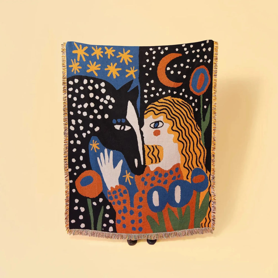 Colorful tapestry with abstract design of a woman and a horse against a starry night sky.