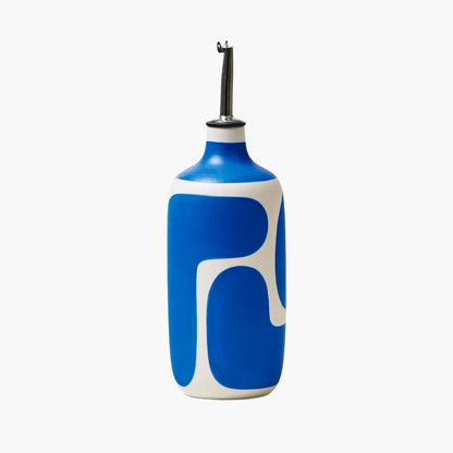 Blue and white olive oil bottle with a black nozzle on a white background