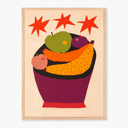 Kitchen wall art featuring a framed art print with a stylized fruit bowl illustration with red starbursts above, shown against a plain light background.