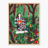 Wall art framed in light oak timber featuring a stylized illustration of a woman in a green and burgundy diamond-patterned sweater sitting in a forest clearing with flowers, set against a light gray background.