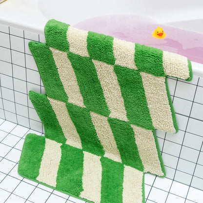 Green and white checkered bath mat on a grid background
