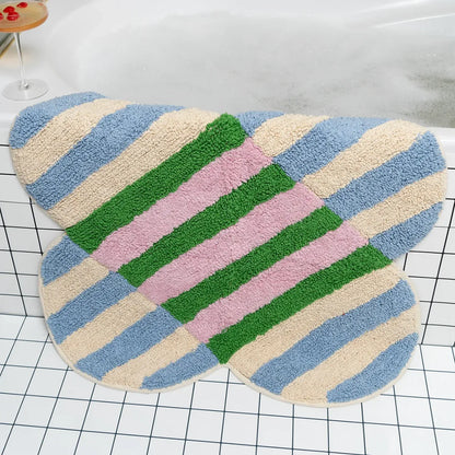 Multicolored striped bath mat on a checkered floor