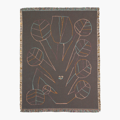 Textile with abstract leaf design on a plain background